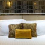 pillows on beds in hotel